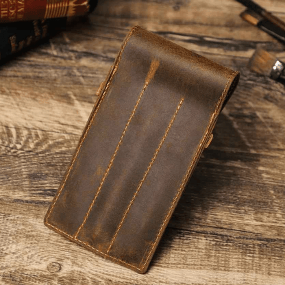 Leather pen case opened to show three individual pen slots