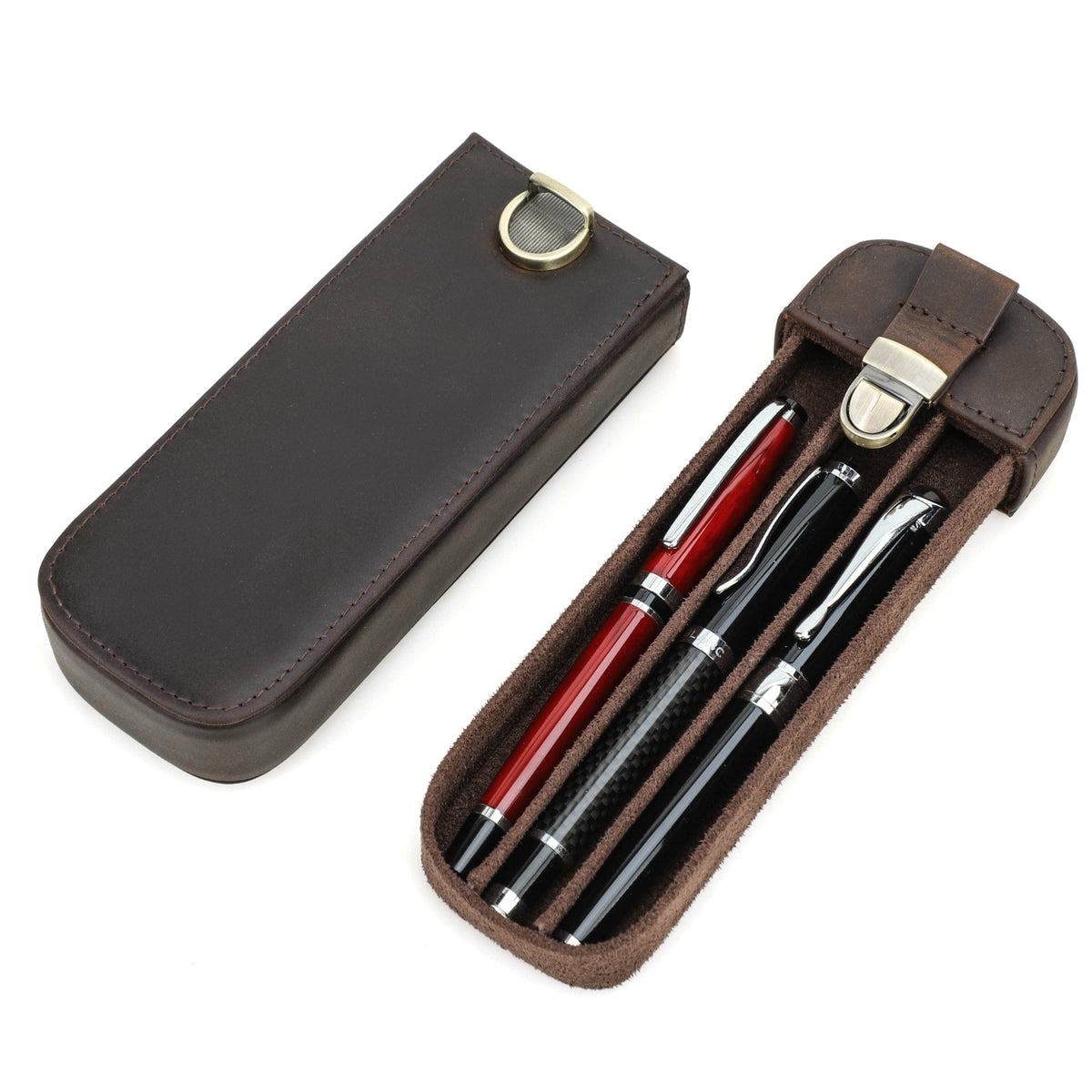 Leather three-pen case closed with a brass closure