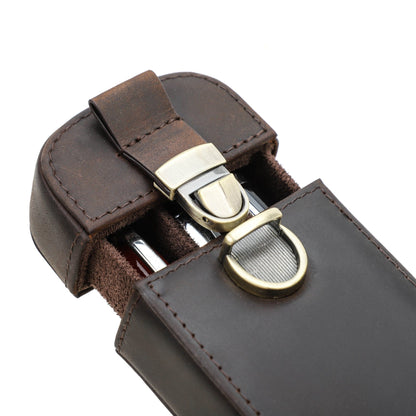 Three pens arranged inside an open leather pen case