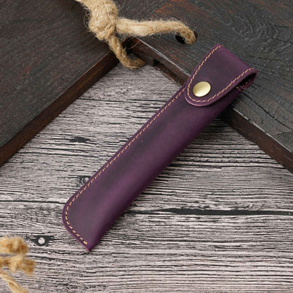 Leather pen pouch lying flat with the snap closure visible