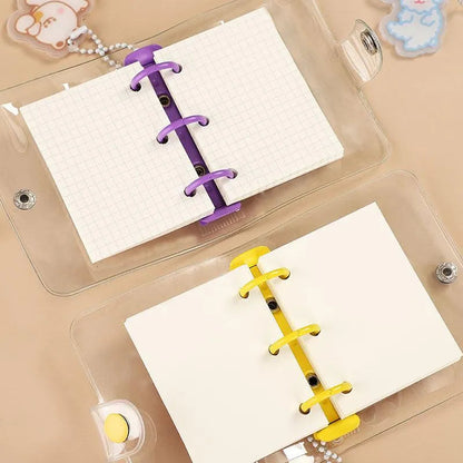Mini ring binder opened to show included paper inserts