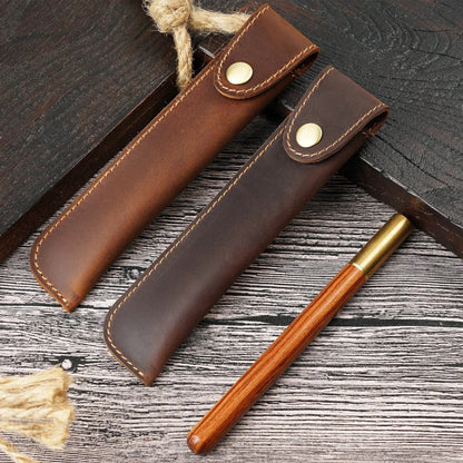 Leather single fountain pen case shown closed with a secure snap closure