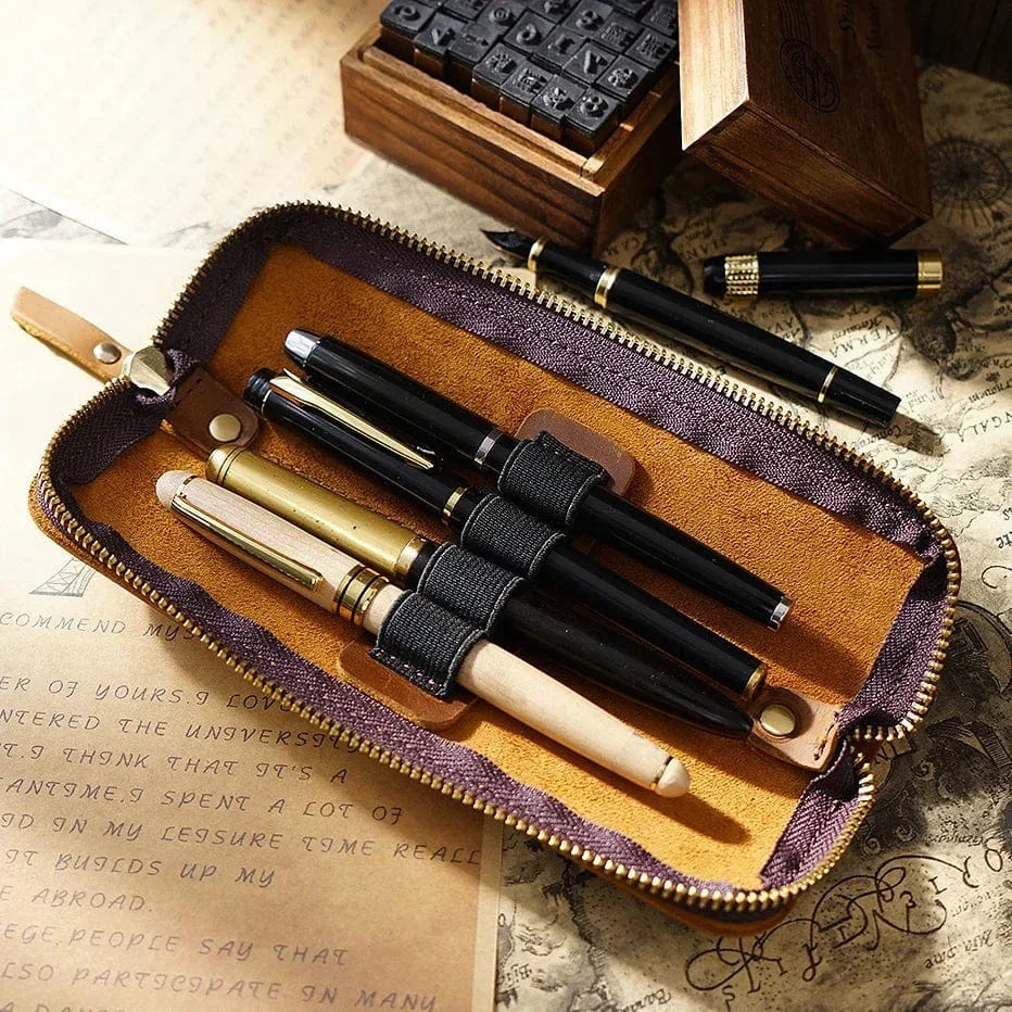 Leather 4-slot zippered pen case shown closed