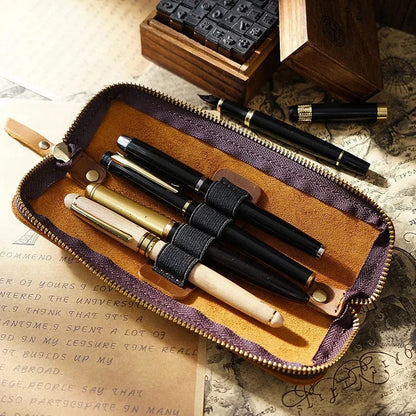 Leather 4-slot zippered pen case shown closed