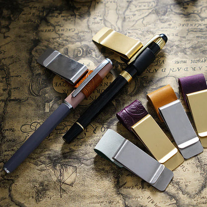 Leather journal pen clip with card and cash holder attached to a notebook