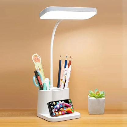 Rechargeable LED desk lamp with adjustable arm on a workspace