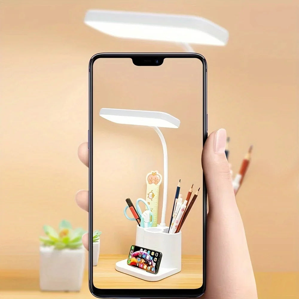 LED desk lamp providing focused light beside a computer