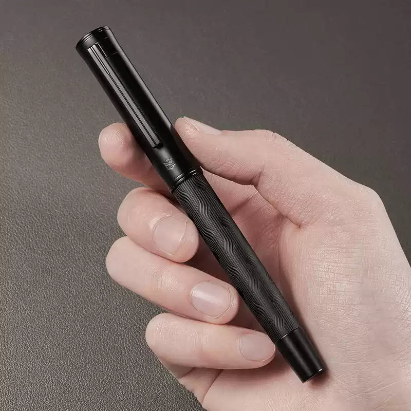 Black metal rollerball pen shown with its fine 0.5 mm writing tip