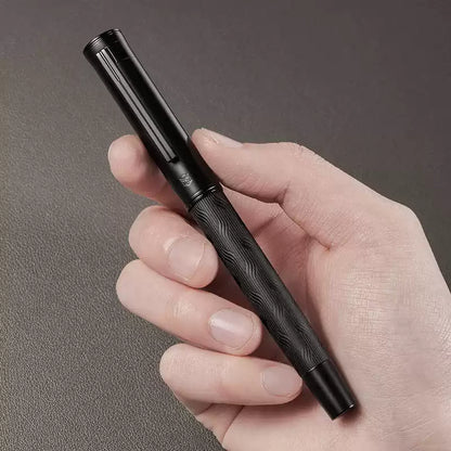 Black metal rollerball pen shown with its fine 0.5 mm writing tip