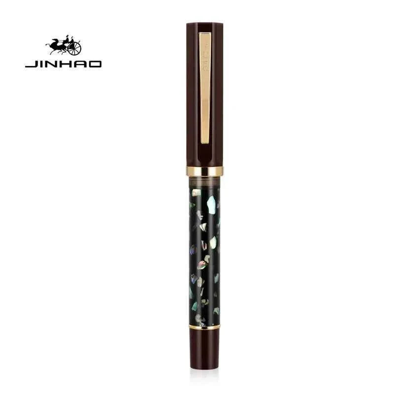 Fountain pen cap and barrel highlighting the carved shell pattern