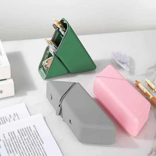 Expandable silicone pencil case standing upright on a desk