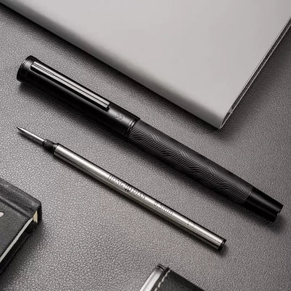 Rollerball pen displayed beside two included replacement refills