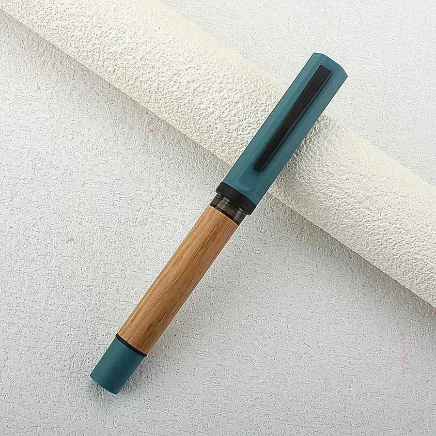 Natural oak fountain pen displayed with its matching wooden cap