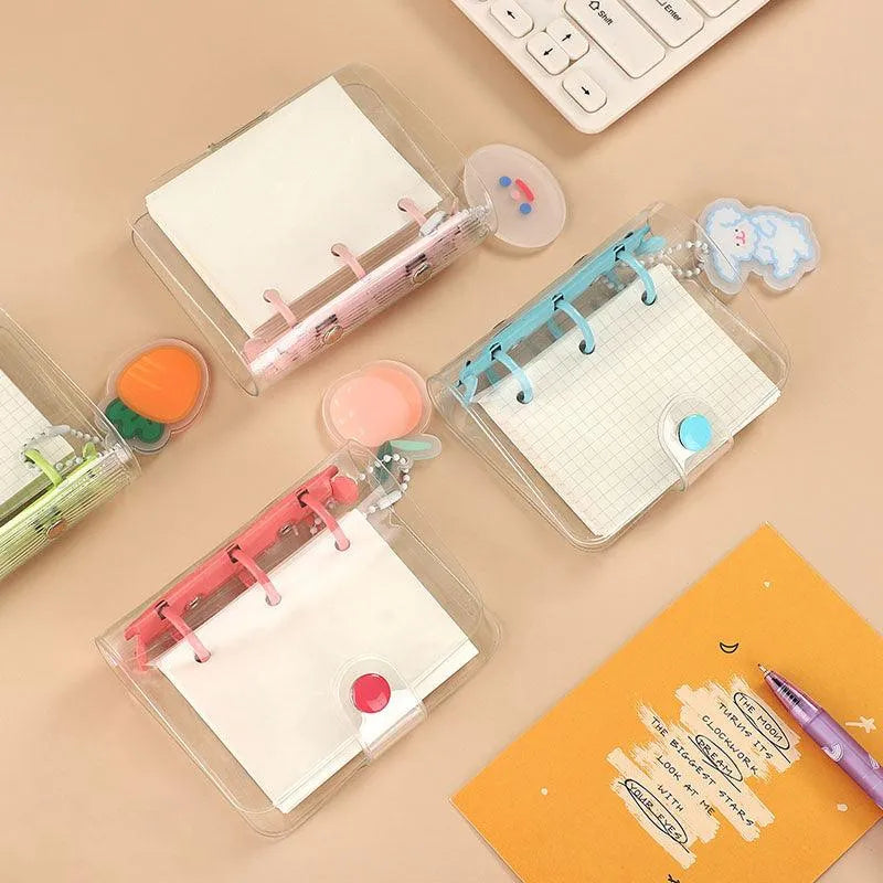 Set of mini transparent ring binders arranged together