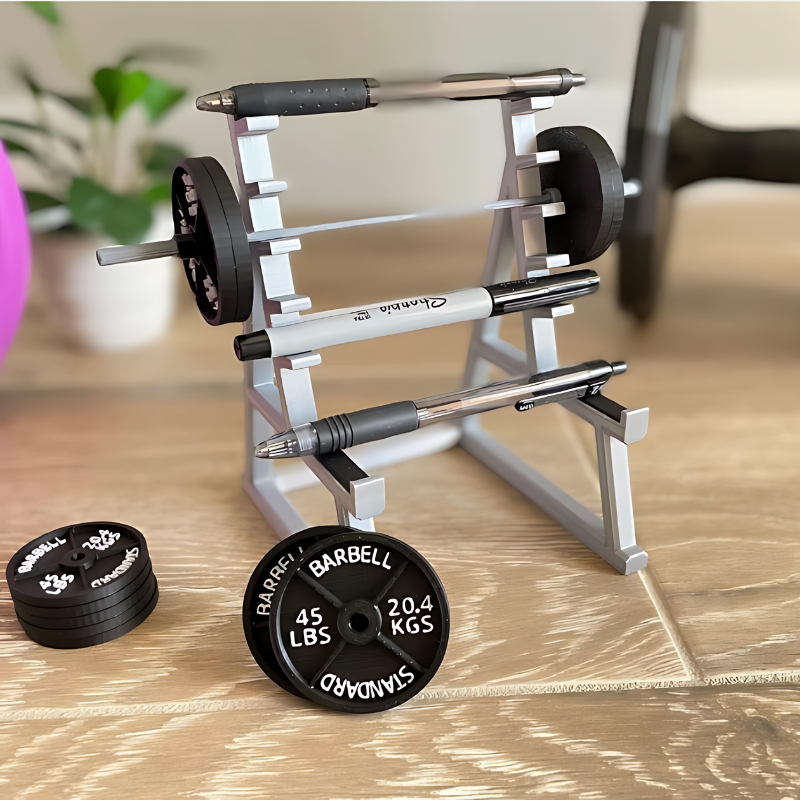 Squat rack-shaped pen holder desk organizer displayed on a workspace