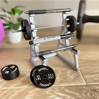 Squat rack-shaped pen holder desk organizer displayed on a workspace
